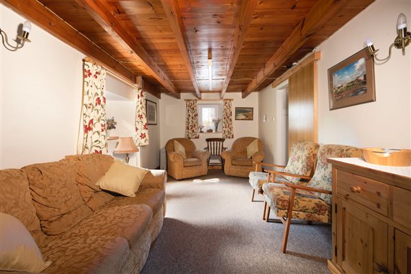 THE SITTING ROOM OF THE COTTAGE